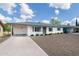 Charming single story home with desert front landscaping and carport at 5328 E Yale St, Phoenix, AZ 85008