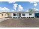 Charming home featuring a desert landscape, covered parking, and gray trim at 5328 E Yale St, Phoenix, AZ 85008
