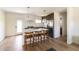 Bright kitchen featuring quartz countertops, stainless appliances, and a view of the backyard at 5328 E Yale St, Phoenix, AZ 85008