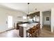 Open kitchen design featuring quartz countertops, stainless appliances, and hardwood floors at 5328 E Yale St, Phoenix, AZ 85008