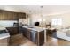 Modern kitchen with island seating, stainless steel appliances, and quartz countertops at 5328 E Yale St, Phoenix, AZ 85008
