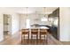 Well-lit kitchen with quartz countertops, new stainless steel appliances, and hardwood floors at 5328 E Yale St, Phoenix, AZ 85008