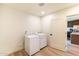 The laundry room features white appliances and easy access to the kitchen at 5328 E Yale St, Phoenix, AZ 85008