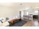 Bright living area with hardwood floors, open to the modern kitchen with island seating at 5328 E Yale St, Phoenix, AZ 85008
