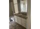 A bathroom with white cabinetry and tile flooring at 653 W Guadalupe Rd # 2019, Mesa, AZ 85210