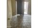 This bedroom has tile flooring, and a sliding glass door leading to a balcony at 653 W Guadalupe Rd # 2019, Mesa, AZ 85210