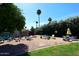 Outdoor entertaining space featuring patio furniture and desert landscaping at 7537 W Bluefield Ave, Glendale, AZ 85308