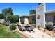 Outdoor patio area with comfortable seating and manicured landscaping at 7537 W Bluefield Ave, Glendale, AZ 85308