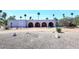 Charming home featuring an arched facade with a gravel yard and desert landscaping at 7537 W Bluefield Ave, Glendale, AZ 85308