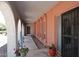 Covered walkway with a stucco wall and arched accents at 7537 W Bluefield Ave, Glendale, AZ 85308