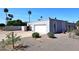 Home exterior featuring large garage, arched windows, and desert landscaping at 7537 W Bluefield Ave, Glendale, AZ 85308