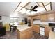 Bright kitchen with wood cabinets, a large island, and tile flooring near a breakfast nook at 7537 W Bluefield Ave, Glendale, AZ 85308