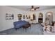 Inviting living room with stylish seating, arched doorways, and tasteful wall decor at 7537 W Bluefield Ave, Glendale, AZ 85308