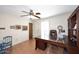 Office features a classic executive desk, ceiling fan, and bright natural light at 7537 W Bluefield Ave, Glendale, AZ 85308