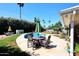 Outdoor patio furniture with pool and lush landscaping for entertaining at 7537 W Bluefield Ave, Glendale, AZ 85308