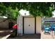Backyard features an outdoor storage shed with double doors at 7537 W Bluefield Ave, Glendale, AZ 85308