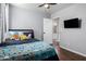 Bright bedroom with a large closet and a doorway to a well-appointed bathroom at 960 W Hudson Way, Gilbert, AZ 85233