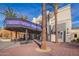 Attractive building entrance with palm trees, brick walkway, and modern architectural design at 960 W Hudson Way, Gilbert, AZ 85233