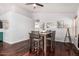 Light, bright dining area with wood floors, seating for four, and contemporary decor at 960 W Hudson Way, Gilbert, AZ 85233