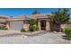 Charming single-story home featuring desert landscaping, an attached two-car garage and covered entryway at 960 W Hudson Way, Gilbert, AZ 85233
