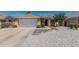 Inviting single-story home featuring a well-kept yard, desert landscaping and an attached two-car garage at 960 W Hudson Way, Gilbert, AZ 85233