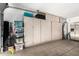 Spacious garage with built-in cabinets, perfect for storage and organization of tools, equipment, and household items at 960 W Hudson Way, Gilbert, AZ 85233