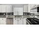 Bright kitchen showcasing stainless steel appliances, granite countertops, and white cabinets at 960 W Hudson Way, Gilbert, AZ 85233