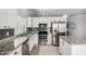 Bright kitchen featuring stainless steel appliances, white cabinets, and tile floors at 960 W Hudson Way, Gilbert, AZ 85233