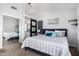Tastefully decorated main bedroom with a sliding barn door that leads to the bathroom at 960 W Hudson Way, Gilbert, AZ 85233