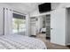 Bright main bedroom with a mirrored closet, poolside views, and neutral color palette at 960 W Hudson Way, Gilbert, AZ 85233