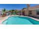 Refreshing backyard pool with easy access steps and a view of the covered patio, perfect for enjoying sunny days outdoors at 960 W Hudson Way, Gilbert, AZ 85233