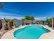 Backyard pool featuring desert landscaping and comfortable seating areas, ideal for relaxation and enjoying the outdoor space at 960 W Hudson Way, Gilbert, AZ 85233