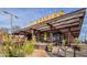 Exterior view of the Postino restaurant, featuring a modern design and inviting outdoor seating area at 960 W Hudson Way, Gilbert, AZ 85233