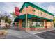 Restaurant exterior featuring a green awning, classic architecture, and a welcoming facade at 960 W Hudson Way, Gilbert, AZ 85233