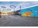 Modern streetscape featuring unique lighting fixtures and colorful mural art, enhancing the urban environment at 960 W Hudson Way, Gilbert, AZ 85233