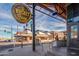 A perspective of Dierks Bentley's Whiskey Row showcasing its vibrant facade and lively atmosphere on the street at 960 W Hudson Way, Gilbert, AZ 85233