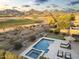 Stunning backyard featuring a pool, putting green, spa, and mountain views, perfect for outdoor living at 10478 E Sheena Dr, Scottsdale, AZ 85255