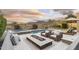 Inviting backyard with a pool, spa, fire pit, lounge chairs, and serene mountain views at 10478 E Sheena Dr, Scottsdale, AZ 85255