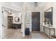 Entryway featuring a console table, chandelier, and a view into the office at 10478 E Sheena Dr, Scottsdale, AZ 85255