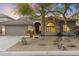 Charming home featuring mature landscaping, a two-car garage, and a tiled roof at 10478 E Sheena Dr, Scottsdale, AZ 85255