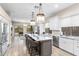 Spacious kitchen with island seating, stainless steel appliances, and modern light fixtures at 10478 E Sheena Dr, Scottsdale, AZ 85255