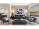 Living room showcasing modern furniture, decorative lamps, and a plush rug at 10478 E Sheena Dr, Scottsdale, AZ 85255