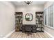 Office space with built-in shelves, desk, and shuttered window at 10478 E Sheena Dr, Scottsdale, AZ 85255