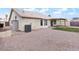 Spacious backyard featuring rock landscaping, artificial grass and covered patio at 1061 E Linda Ln, Gilbert, AZ 85234