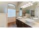 Bathroom featuring dual sinks, generous counter space, modern fixtures, and updated lighting at 1061 E Linda Ln, Gilbert, AZ 85234