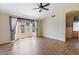 Relaxing bedroom featuring sleek floors, a ceiling fan, and bright natural lighting at 1061 E Linda Ln, Gilbert, AZ 85234