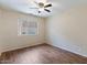 Cozy bedroom featuring sleek floors, a ceiling fan, and bright natural lighting at 1061 E Linda Ln, Gilbert, AZ 85234