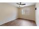 Bedroom featuring wood flooring, a ceiling fan, and bright natural lighting at 1061 E Linda Ln, Gilbert, AZ 85234