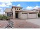 Charming single-story home with a tile roof, desert landscaping, and a convenient two-car garage at 1061 E Linda Ln, Gilbert, AZ 85234