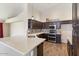 Well-equipped kitchen featuring stainless steel appliances and light countertops at 1061 E Linda Ln, Gilbert, AZ 85234